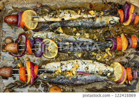 Baked sardines skewers. Baked sardines skewers. 122418869
