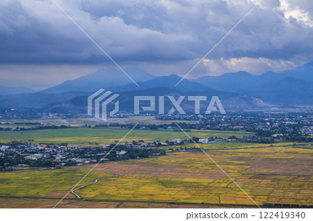 top view of rice fields with villages on background of mountains in Vietnam in Asia in evening top view of rice fields with villages on background of mountains in Vietnam in Asia in evening 122419340