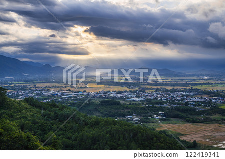 top view of rice fields with villages against background of mountains in Vietnam in Asia in the evening 122419341