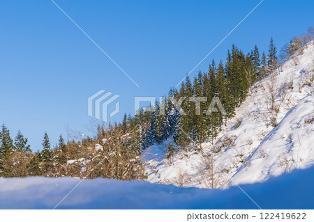 Winter blue sky and snowy mountains 122419622