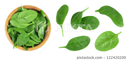 Baby spinach leaves in wooden bowl isolated on white background. Top view. Flat lay 122420200