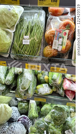 Organized Display of Fresh Vegetables in Supermarket Section 122420519