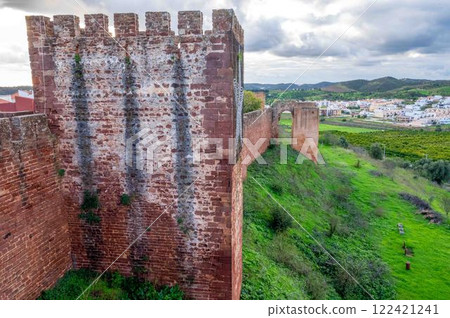 Massive castle dominates a pastoral landscape Silves Portugal Algarve 122421241