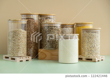 Set of Raw porridges in sustainable packaging. Refillable systems of packaging. Gluten free cereals. Health gut benefits. Concept of alternative whole spelt grain ingredient. Vegetarian diet recipes 122421446