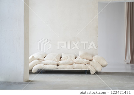 In the foreground of the wall is a creative composition of the living room interior with an uneven sofa made of pillows in a modern style. Home decor. With space to copy. High quality photo 122421451