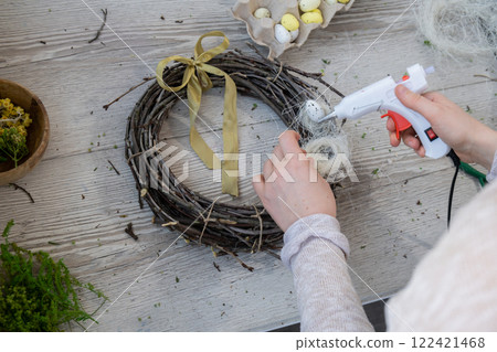 DIY process of woman making candid Easter wreath arrangement decor. Small business, self employed entrepreneur, self-made career. Series of handmade craft instruction. Zero waste eco-friendly DIY process of woman making candid Easter wreath arrangement decor. Small business, self employed entrepreneur, self-made career. Series of handmade craft instruction. Zero waste eco-friendly 122421468
