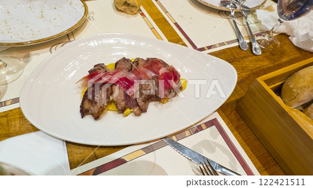 Grilled Meat with Serrano Ham, Spain 122421511