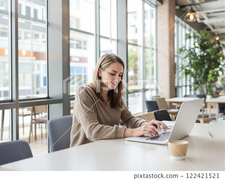 A Young Professional Working Remotely in a Modern and Inspiring Workspace Setting 122421521