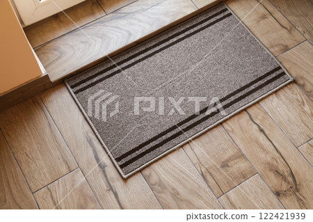 Door Mat Entryway. Outdoor Mat. Mock up Entry Mat. Wooden Brown floor. Top View 122421939