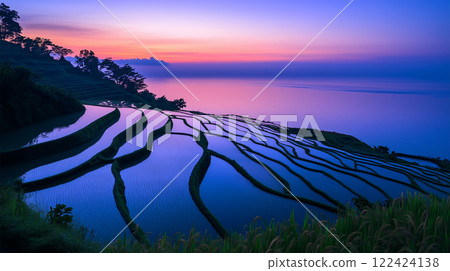 Spectacular view of rice terraces and the sea at sunset 122424138