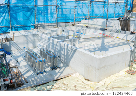 Construction of foundation for new house and installation of stepladder, scaffolding and mesh sheet Construction of foundation for new house and installation of stepladder, scaffolding and mesh sheet 122424403