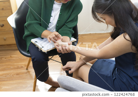 Parents telling the psychologist about family or child problems. Depressed girl and her parent or grandpa having session with psychiatrist in clinic. Parents telling the psychologist about family or child problems. Depressed girl and her parent or grandpa having session with psychiatrist in clinic. 122424768