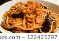 Tomato pasta with eggplant and carrots, a dish that is colorful and flavorful 122425787