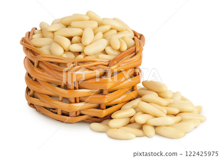 Shelled European pine nuts in a wicker basket isolated on white background with full depth of field Shelled European pine nuts in a wicker basket isolated on white background with full depth of field 122425975