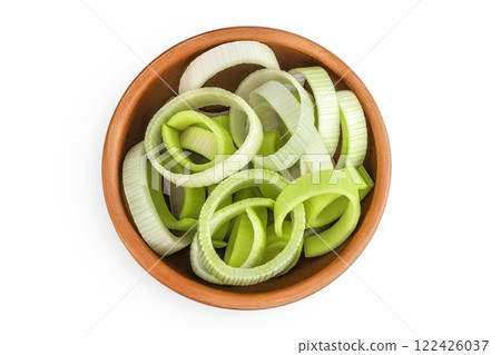 sliced Leek vegetable in ceramic bowl isolated on white background. Top view. Flat lay sliced Leek vegetable in ceramic bowl isolated on white background. Top view. Flat lay 122426037