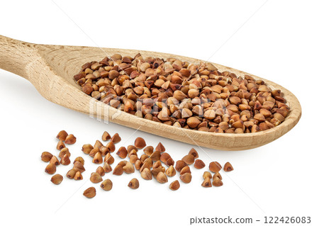 Raw buckwheat in wooden spoon isolated on white background Raw buckwheat in wooden spoon isolated on white background 122426083