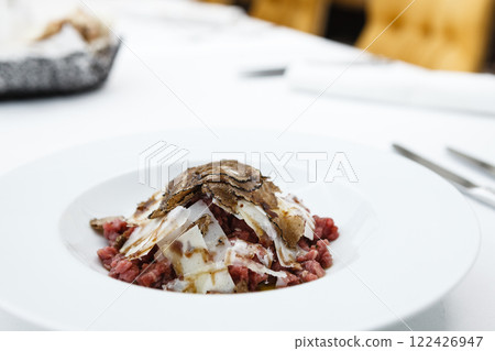 Veal tartare with truffle served on a plate 122426947