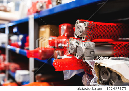 Colored warehouse racks for storing pneumatic cylinders for the production of factory machines and equipment. 122427175