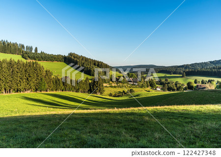 Green hilly landscape with farm houses in Black Forest, Germany Green hilly landscape with farm houses in Black Forest, Germany 122427348