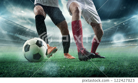 Tactical duel. Two soccer players from opposing teams fighting for ball on wet field during intense match. 3D stadium. 122427823