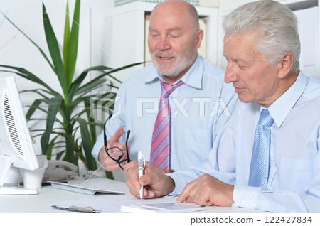 Senior businessmen sitting at desk and working 122427834