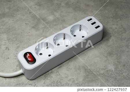 Network filter. Extension cord tee with three sockets and two USB ports for powering household electrical appliances 122427937