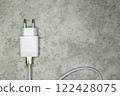 Power adapter with USB cable on gray. Charger for home electronics 122428075