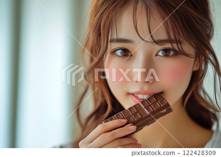 Asian woman holding chocolate 122428309