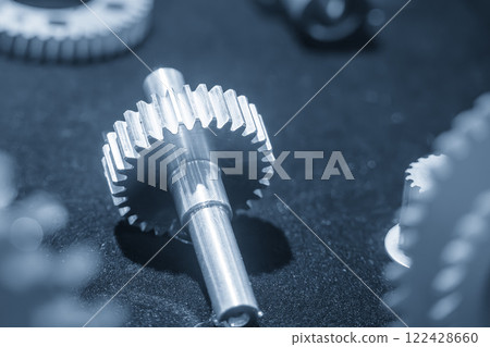 Close up scene the pinion gear shaft parts in the light blue scene. Close up scene the pinion gear shaft parts in the light blue scene. 122428660