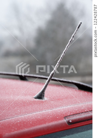 Frozen roof with antenna on car. Concept for winter time and transportation 122428787