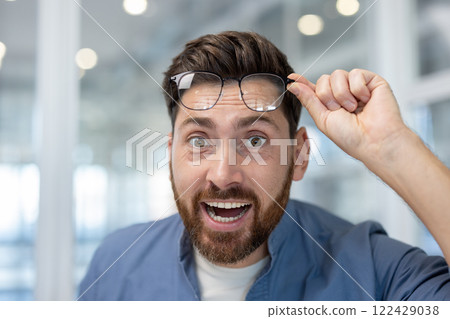 Portrait of a joyful man, office worker smiling at the camera, received good news, surprised. Portrait of a joyful man, office worker smiling at the camera, received good news, surprised. 122429038