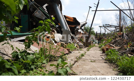 View to destroyed residential buildings at Kharkivska oblast. Ruined houses after bomb attacks on ukrainian territory from russia army. Consequences of russian invasion of Ukraine. Slow motion View to destroyed residential buildings at Kharkivska oblast. Ruined houses after bomb attacks on ukrainian territory from russia army. Consequences of russian invasion of Ukraine. Slow motion 122430717