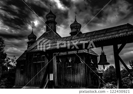 A Historic Wooden Church Stands Majestically Under Dramatic, EverChanging Skies Above 122430921
