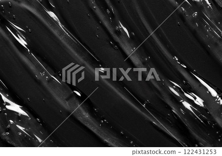 Transparent cosmetic moisturizing gel or skin serum on a black background 122431253