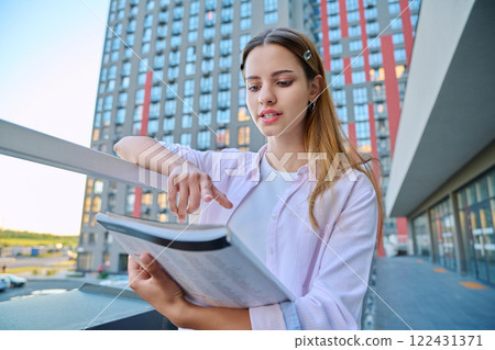 Webcam portrait young woman teenager looking talking listening to camera, outdoor 122431371