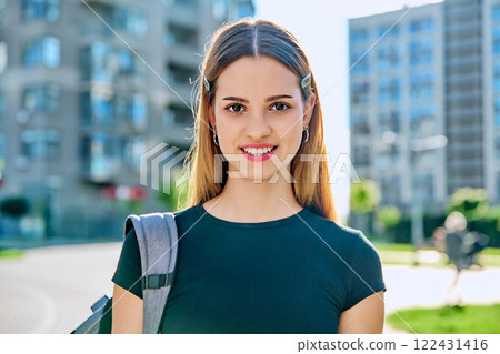 Headshot portrait smiling student teenage girl with backpack outdoor Headshot portrait smiling student teenage girl with backpack outdoor 122431416
