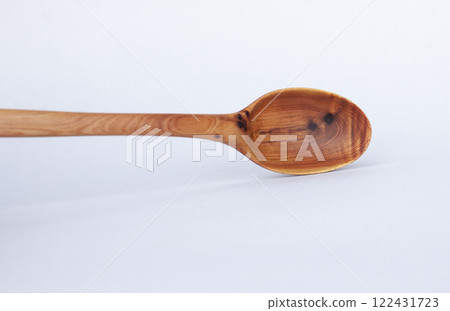 Wooden kitchen utensils stacked view close up 122431723