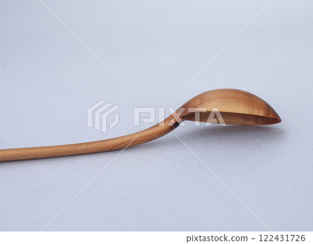 Wooden kitchen utensils stacked view close up Wooden kitchen utensils stacked view close up 122431726