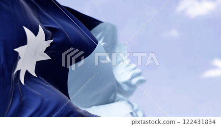 Close-up of Minnesota new state flag waving with the american flag on a clear day 122431834