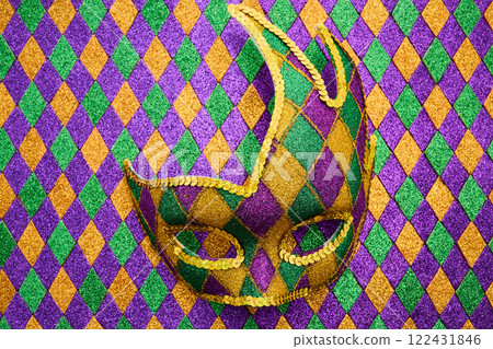 Festive Jester Mask. A vibrant jester mask with a diamond pattern Festive Jester Mask. A vibrant jester mask with a diamond pattern 122431846