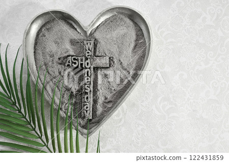 Ash Wednesday Symbol. Heart-shaped ash tray with cross and palm leaf Ash Wednesday Symbol. Heart-shaped ash tray with cross and palm leaf 122431859