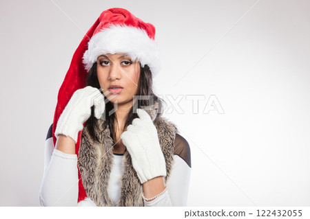 Woman mixed race santa helper hat portrait Woman mixed race santa helper hat portrait 122432055