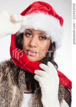 Woman mixed race santa helper hat portrait Woman mixed race santa helper hat portrait 122432058