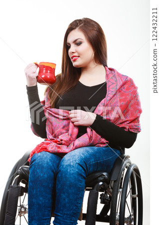 Cheerful crippled lady on wheelchair. 122432211