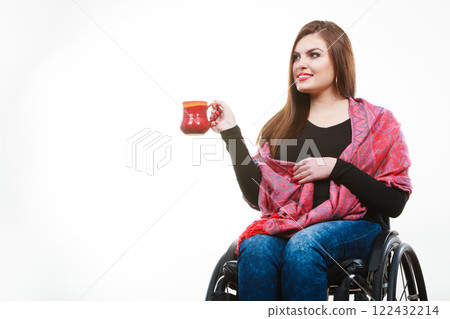 Cheerful crippled lady on wheelchair. Cheerful crippled lady on wheelchair. 122432214