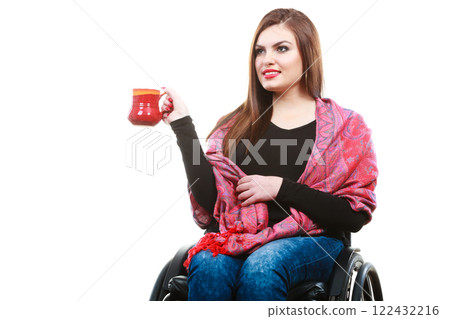 Woman in wheelchair with mug Woman in wheelchair with mug 122432216