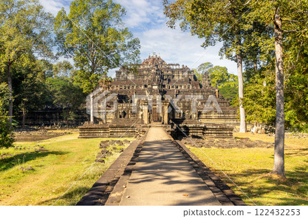 An ancient temple, resplendent and majestic, is beautifully surrounded by lush greenery and trees An ancient temple, resplendent and majestic, is beautifully surrounded by lush greenery and trees 122432253