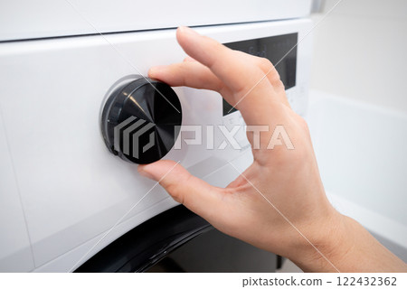 White washing machine in a utility room 122432362