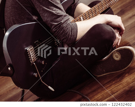 Male hands playing electric guitar 122432402