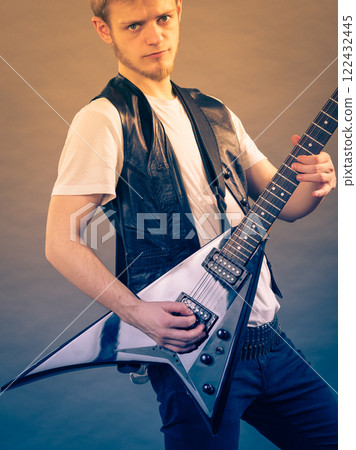Man playing on electric guitar 122432445